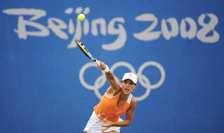 Nuria Llagostera Vives of Spain serves to Zheng Jie of China at the second round of women's singles during the Beijing Olympic tennis event in Beijing, China, Aug. 12, 2008. Zheng Jie beat Nuria Llagostera Vives 2-1. [Xinhua]