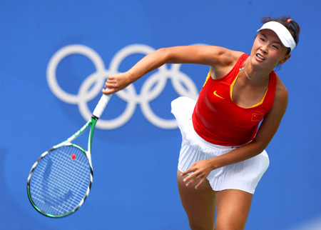 Peng Shuai of China hits a return against Alize Cornet of France at the second round of women's singles during the Beijing Olympic Games tennis event in Beijing, China, Aug. 12, 2008. Alize Cornet won the match 2-0. [Xinhua]