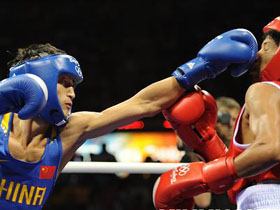 Chinese boxing gold hopeful Zou Shiming dances to win his Olympic debut