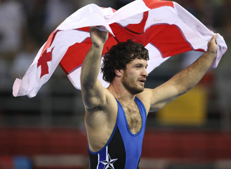 Manuchar Kvirkelia of Georgia celebrates during the men's Greco-Roman 74kg final of wrestling against Chang Yongxiang of China at Beijing 2008 Olympic Games in Beijing, China, Aug. 13, 2008. Manuchar Kvirkelia of Georgia won the gold medal in the match. (Xinhua/Lu Mingxiang)