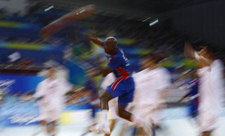 Girault (C) of France attacks during Men's Preliminaries Group A-Match 9 between China and France of Beijing 2008 Olympic Games handball event at OSC Gymnasium in Beijing, China, Aug 12, 2008. France beat China 33-19.[Xinhua] 