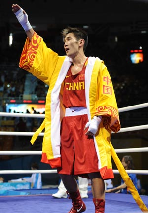 Gu Yu of China celebrates his victory over Joe Murrray of Great Britain during Men's Bantam (54kg) round of 32 at the Beijing Olympic Games boxing event in Beijing, China, Aug 12, 2008.[Xinhua] 