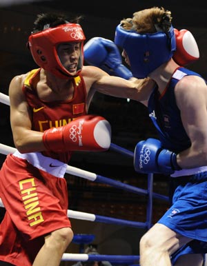 Gu Yu (red) of China fights with Joe Murrray of Great Britain during Men's Bantam (54kg) round of 32 at the Beijing Olympic Games boxing event in Beijing, China, Aug 12, 2008. Gu Yu won the match.[Xinhua] 