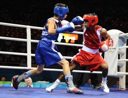 Jitender Kumar (red) of India fights with Furkan Ulas Memis of Turkey during Men's Fly (51kg) round of 32 at the Beijing Olympic Games boxing event in Beijing, China, Aug 12, 2008. Jitender Kumar of India won the match.[Xinhua] 