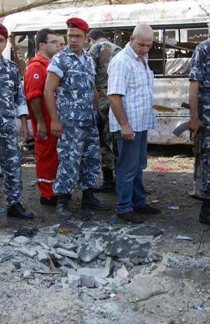 Soldiers inspect the area following a bomb blast in the port city of Tripoli in north Lebanon Aug. 13, 2008. (Xinhua/Reuters Photo)