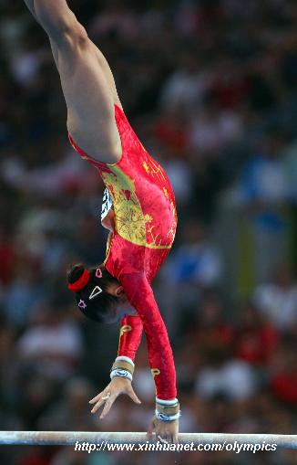 China&apos;s He Kexin performs the uneven bars during gymnastics artistic women&apos;s team final of the Beijing 2008 Olympic Games at National Indoor Stadium in Beijing, China, Aug. 13, 2008. (Xinhua/Lin Hui)