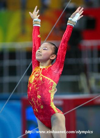 China&apos;s He Kexin reacts after the uneven bars competition during gymnastics artistic women&apos;s team final of the Beijing 2008 Olympic Games at National Indoor Stadium in Beijing, China, Aug. 13, 2008. (Xinhua/Lin Hui)