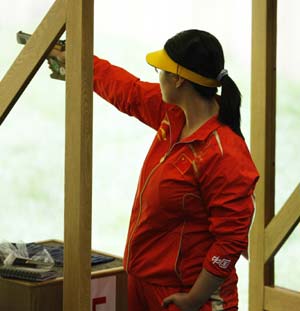 Chen Ying of China competes in the precision stage of the women's 25m pistol qualification of the Beijing 2008 Olympic Games shooting event at the Beijing Shooting Range Hall in Beijing, China, Aug 13, 2008.[Bao Feifei/Xinhua Photo] 