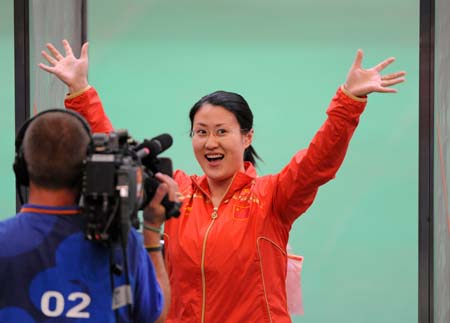Chen Ying of China celebrates during the women's 25m pistol final of the Beijing 2008 Olympic Games shooting event at the Beijing Shooting Range Hall in Beijing, China, Aug. 13, 2008. Chen Ying shot 793.4 points to win the gold medal of the event. [Xinhua] 