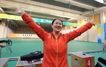 Chen Ying of China celebrates during the women's 25m pistol final of the Beijing 2008 Olympic Games shooting event at the Beijing Shooting Range Hall in Beijing, China, Aug. 13, 2008. Chen Ying shot 793.4 points to win the gold medal of the event. [Xinhua]
