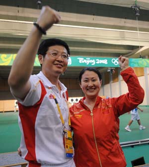 Chen Ying (R) of China celebrates during the women's 25m pistol final of the Beijing 2008 Olympic Games shooting event at the Beijing Shooting Range Hall in Beijing, China, Aug. 13, 2008. Chen Ying shot 793.4 points to win the gold medal of the event. [Xinhua]