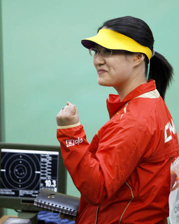 Chen Ying of China gestures after her last shot during the women's 25m pistol final of the Beijing 2008 Olympic Games shooting event at the Beijing Shooting Range Hall in Beijing, China, Aug. 13, 2008. Chen Ying shot 793.4 points to win the gold medal of the event. [Bao Feifei/Xinhua] 