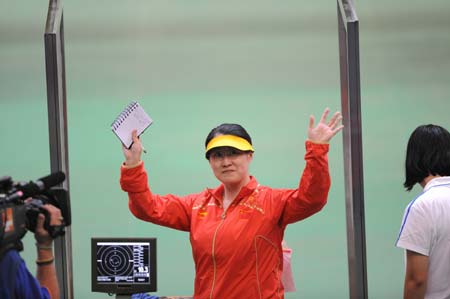Chen Ying of China gestures during the women's 25m pistol final of the Beijing 2008 Olympic Games shooting event at the Beijing Shooting Range Hall in Beijing, China, Aug 13, 2008. Chen Ying won the gold medal of the event.[Bao Feifei/Xinhua Photo] 