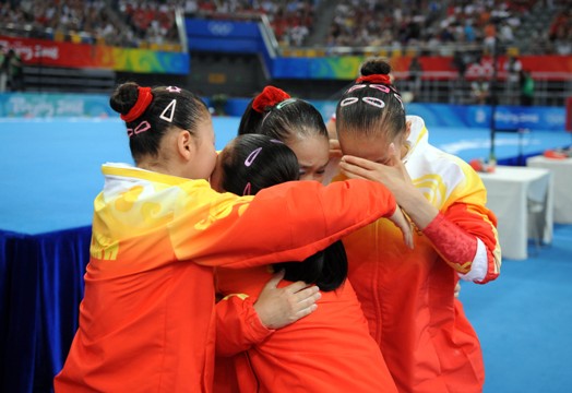 The Chinese women gymnasts won their first ever Olympic team gold in Wednesday's final of the Beijing Olympic Games, making a historic breakthrough expected by China for decades. With deafening hail and applause, Cheng Fei finished her routine in the last event of floor exercise and scored 15.450 points, bringing the gold to the host country which accumulated a winning total of 188.900 points [Xinhua]