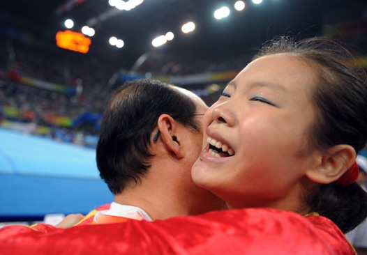 The Chinese women gymnasts won their first ever Olympic team gold in Wednesday's final of the Beijing Olympic Games, making a historic breakthrough expected by China for decades. With deafening hail and applause, Cheng Fei finished her routine in the last event of floor exercise and scored 15.450 points, bringing the gold to the host country which accumulated a winning total of 188.900 points [Xinhua]