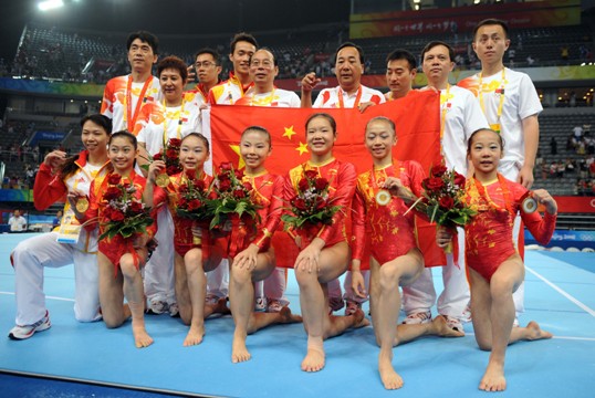 The Chinese women gymnasts won their first ever Olympic team gold in Wednesday's final of the Beijing Olympic Games, making a historic breakthrough expected by China for decades. With deafening hail and applause, Cheng Fei finished her routine in the last event of floor exercise and scored 15.450 points, bringing the gold to the host country which accumulated a winning total of 188.900 points [Xinhua]