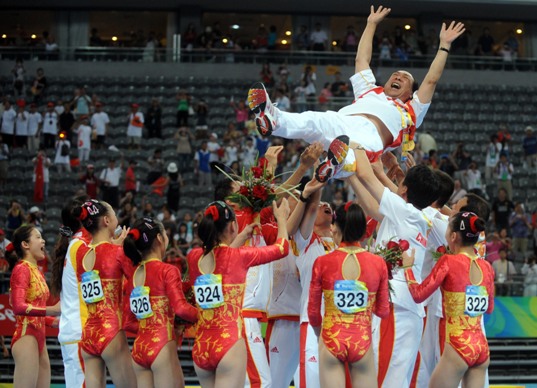 The Chinese women gymnasts won their first ever Olympic team gold in Wednesday's final of the Beijing Olympic Games, making a historic breakthrough expected by China for decades. With deafening hail and applause, Cheng Fei finished her routine in the last event of floor exercise and scored 15.450 points, bringing the gold to the host country which accumulated a winning total of 188.900 points [Xinhua]