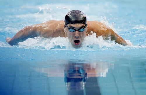 Phelps wins men's 200m butterfly gold in world record time