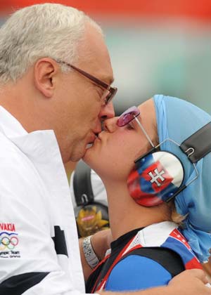 Zuzana Stefecekova (R) of Slovakia kisses her coach after woman's trap final of the Beijing 2008 Olympic Games, in Beijing, China, Aug. 11, 2008. Zuzana won the silver medal on 89 hits. (Xinhua/Jiao Weiping) 