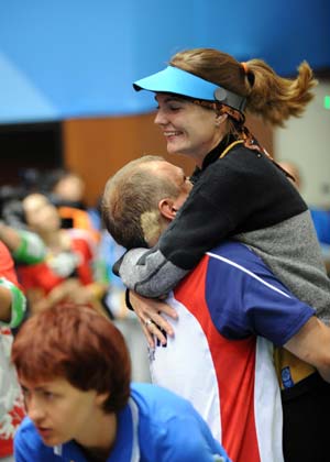 Markswoman Katerina Emmons (R) of Czech celebrates after women's 10m Air rifle final of Beijing Olympic Games at Beijing Shooting Range Hall in Beijing, China, Aug. 9, 2008. Katerina Emmons won the gold medal in the event with 503.5 points. (Xinhua/Jiao Weiping)
