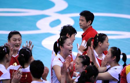 Chen Zhonghe (top), head coach of Chinese women's volleyball team, reacts during the match China VS Cuba in women's preliminary pool A of the Beijing 2008 Olympic Games volleyball event in Beijing, China, Aug. 13, 2008. Cuba beat China 3-2. (Xinhua/Zhao Zhongzhi)