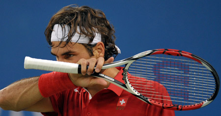 Roger Federer of Switzerland reacts during a match against Tomas Berdych of Czech Republic in men's singles third round of the Beijing 2008 Olympic Games tennis event in Beijing, China, Aug. 13, 2008. Roger Federer won the match 2-0. [Wang Yuguo/Xinhua]