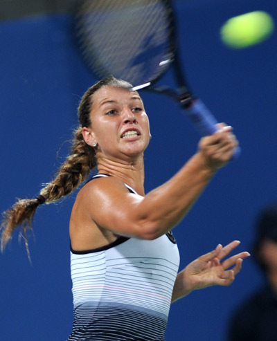 Dominika Cibulkova of Slovakia returns the ball to Jelena Jankovic of Serbia in women's singles third round of the Beijing 2008 Olympic Games tennis event in Beijing, China, Aug. 13, 2008. Jelena Jankovic beat Dominika Cibulkova 2-0. [Zou Zheng/Xinhua]