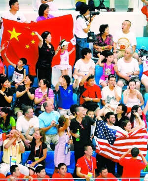 Chinese and overseas fans cheering swimmers in the Water Cube. 