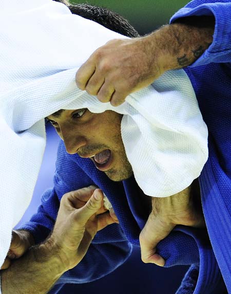 Ilias Iliadis (blue) of Greece competes against Mark Huizinga of Netherlands during their men 90kg preliminary of the Beijing 2008 Olympic Games Judo event at the Beijing Science and Technology University Gymnasium in Beijing, China, Aug. 13, 2008.