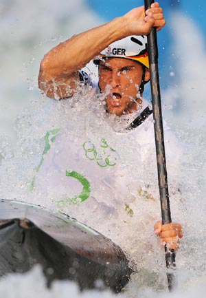 Alexander Grimm of Germany paddles during the men's kayak(K1) final of Olympic canoe/kayak slalom competition, in the Shunyi Rowing-Canoeing Park in Beijing, China, Aug. 12, 2008. Grimm claimed the title in this event.