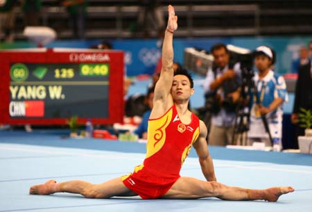 Yang Wei of China performs on the floor during gymnastics artistic men's individual all-around final of Beijing 2008 Olympic Games at National Indoor Stadium in Beijing, China, Aug. 14, 2008. 
