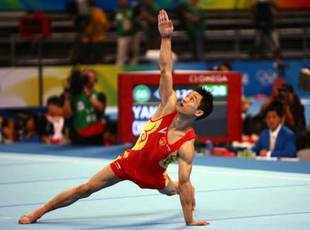 Yang Wei of China performs on the floor during gymnastics artistic men&apos;s individual all-around final of Beijing 2008 Olympic Games at National Indoor Stadium in Beijing, China, Aug. 14, 2008. 