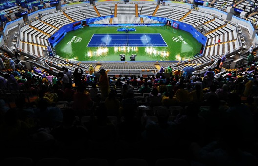 Heavy rain interrupts the tennis match of the Olympics. Besides, outdoor competitions like baseball and softball are also amongst the directly affected by the weather [Xinhua]