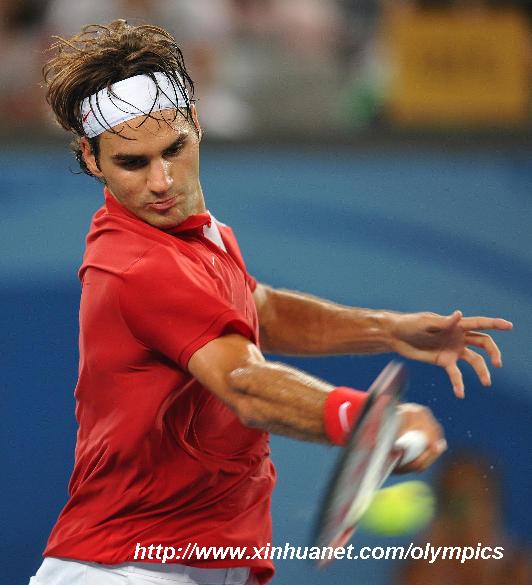 Roger Federer of Switzerland hits a return against James Blake of the United States during the men's singles quarterfinal of the Beijing 2008 Olympic Games tennis event at the Beijing Olympic Green Tennis Court in Beijing, China, Aug. 14, 2008.