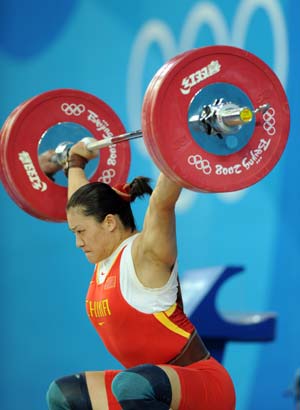 Cao Lei of China tries a lift during women's 75kg group A competition of the Beijing 2008 Olympic Games weightlifting event in Beijing, China, Aug. 15, 2008. Cao Lei set the new Olympic record of women's 75kg snatch with 128 kg.
