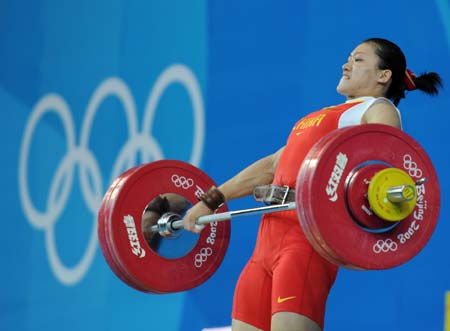 Cao Lei of China tries a lift during women's 75kg group A competition of the Beijing 2008 Olympic Games weightlifting event in Beijing, China, Aug. 15, 2008. Cao Lei set the new Olympic record of women's 75kg snatch with 128 kg. 