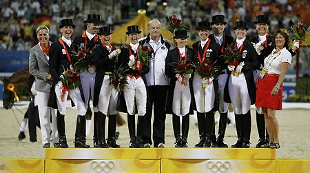 Riders and coaches of the medal-winning teams of Germany, Netherlands and Denmark celebrate on the podium during the awarding ceremony of dressage team final of Beijing 2008 Olympic equestrian events in the Olympics co-host city of Hong Kong, south China, Aug 14, 2008.