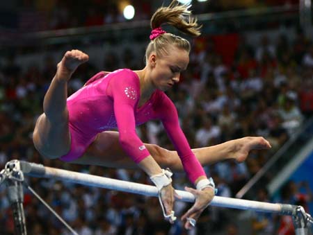 Nastia Liukin of the United States performs on the uneven bars during gymnastics artistic women&apos;s individual all-round final of Beijing 2008 Olympic Games at National Indoor Stadium in Beijing, China, Aug. 15, 2008. Liukin claimed the title of the event with a score of 63.325. (Xinhua/Ren Long)