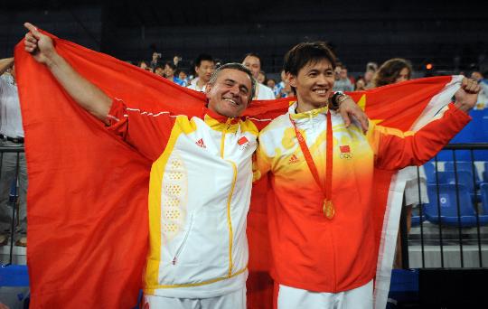 Christian Bauer (L) and Zhong Man after winning the men's saber competition.