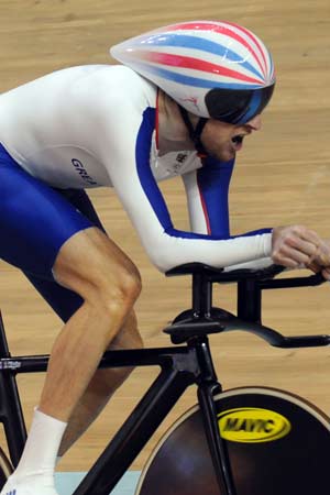 Bradley Wiggins of Britain broke his own Olympic Games record of men's cycling individual pursuit in the qualifying stage in Beijing on Friday.