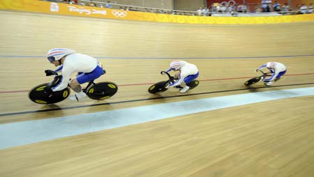 Cyclists of the British team compete at the men's team sprint qualifying of the Beijing 2008 Olympic cycling-track event at the Laoshan Velodrome in Beijing, China, Aug. 15, 2008. The British team ranked 1th with a total time of 42.950 seconds in the qualification and was qualified for the first round. 