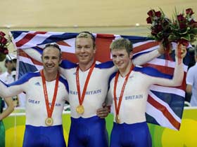 Britain beats France to win cycling team sprint gold.