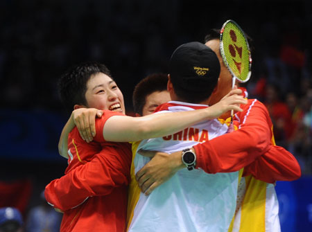 Yu Yang/Du Jing of China celebrate the victory over Lee Kyungwon/Lee Hyojung of South Korea during women's doubles gold medal match of the Beijing 2008 Olympic Games badminton event in Beijing, China, Aug. 15, 2008. Yu Yang/Du Jing beat Lee Kyungwon/Lee Hyojung 2-0 and claimed the gold. [Luo Xiaoguang/Xinhua]
