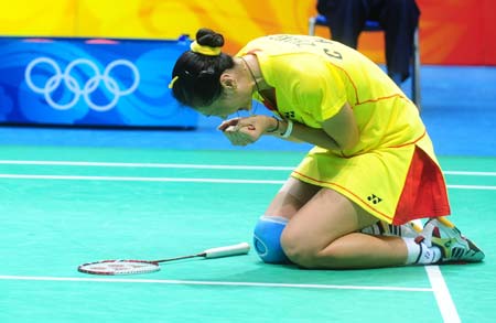 Zhang Ning of China reacts after defeating teammate Xie Xingfang at the women's singles gold medal match during the Beijing 2008 Olympic Games badminton event in Beijing on August 16, 2008. Zhang Ning won the match 2-1 and grabbed the gold medal of the event. (Xinhua/Luo Xiaoguang)