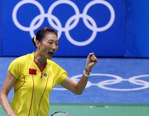 Zhang Ning beat Xie Xingfang 21-12, 10-21 and 21-18 to take the women's badminton singles gold medal.