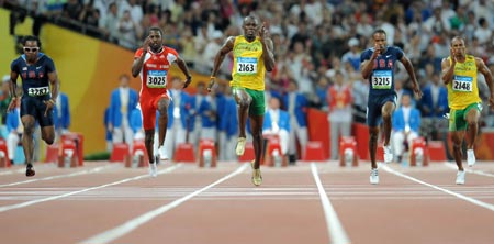Usain Bolt (C) of Jamaica competes during men's 100m final at the National Stadium, also known as the Bird's Nest, during Beijing 2008 Olympic Games in Beijing, China, Aug. 16, 2008. Usain Bolt claimed the title of the event and broke the world record. [Xinhua]