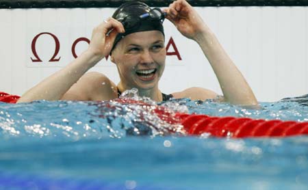 Britta Steffen of Germany smiles during the final of women's 50m freestyle at the Beijing 2008 Olympic Games in the National Aquatics Center, also known as the Water Cube in Beijing, China, Aug. 17, 2008. Britta Steffen won the gold medal with a new Olympic record of 24.06 seconds.
