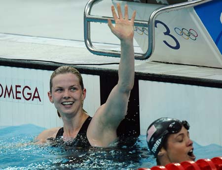 Britta Steffen (L) of Germany celebrates during the final of women's 50m freestyle at the Beijing 2008 Olympic Games in the National Aquatics Center, also known as the Water Cube in Beijing, China, Aug. 17, 2008. Britta Steffen won the gold medal with a new Olympic record of 24.06 seconds.