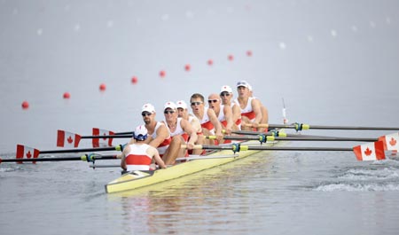 The crew member of the Canada row strokes during Men's Eight Final A of Beijing 2008 Olympic Games rowing event at Shunyi Rowing-Canoeing Park in Beijing, China, Aug. 17, 2008. The Canadian team won the gold medal of the event. [Xinhua Photo]