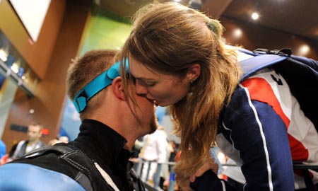 Matthew Emmons of the United States is comforted by his wife after the men's 50m rifle 3 positions final of the Beijing 2008 Olympic Games Shooting event in Beijing, China, Aug. 17, 2008. Matthew Emmons won the 4th with a total of 1270.3. [Jiao Weiping/Xinhua]
